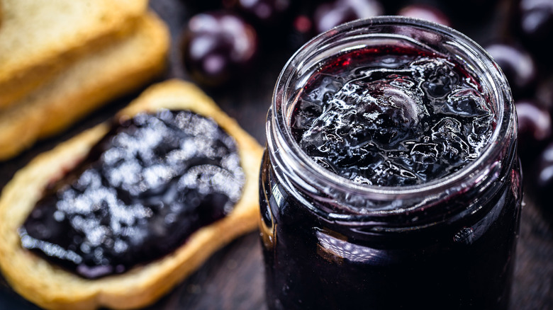 jar of grape jelly and toast
