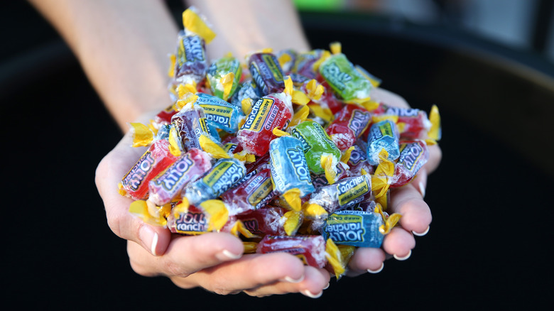 Two handfuls of Jolly Rancher hard candies are seen at the MTV Fandom Awards San Diego at PETCO Park on July 21, 2016 in San Diego, California.