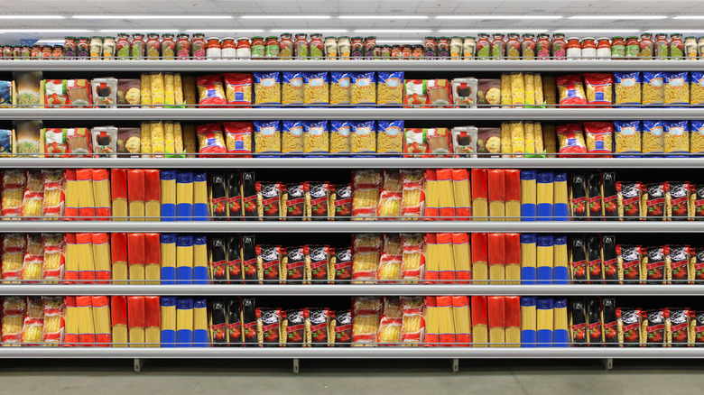 Rows of dried pasta in a grocery store