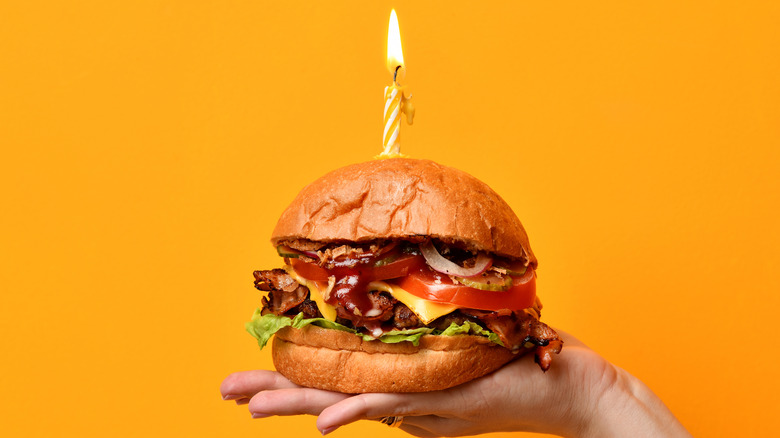 burger with a birthday candle in it
