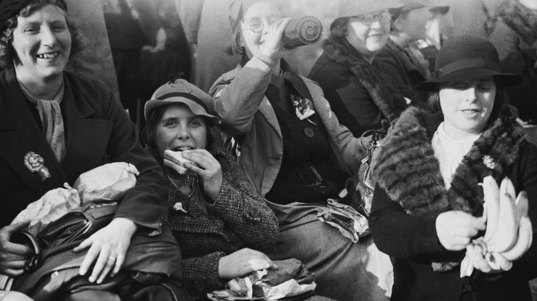 People in the Great Depression drinking, eating sandwiches, and holding bananas