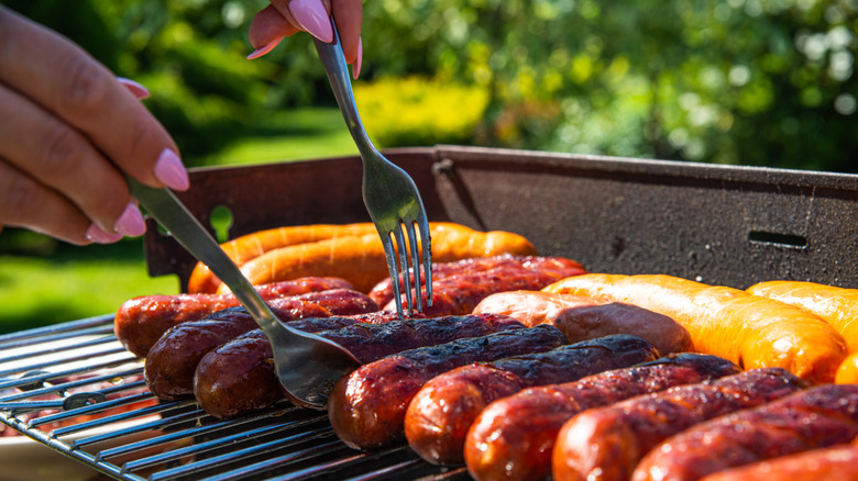 Cooking sausages on the grill