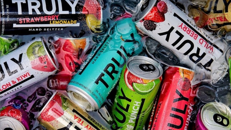 cans of Truly floating in ice water in a cooler