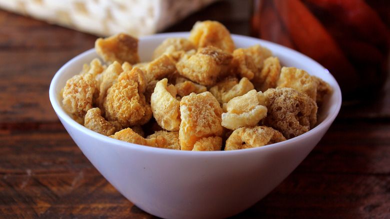 Pork rinds in a white bowl