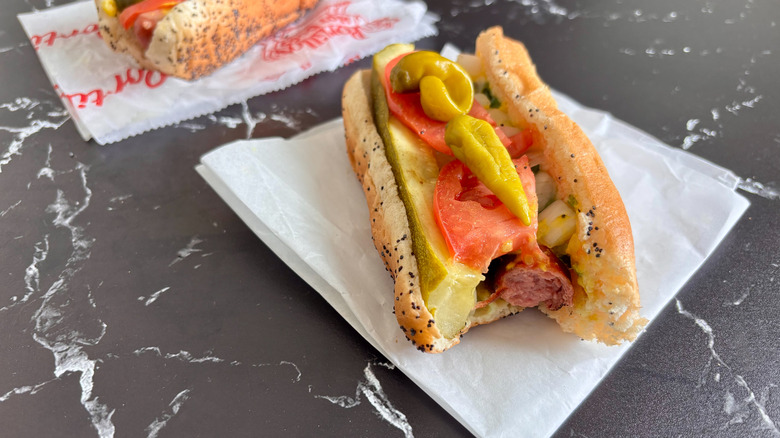 Chicago-style hot dog with bite taken