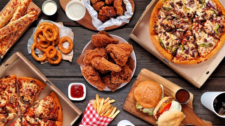 fried chicken, onion rings, pizza, fries, burgers, and other fast food
