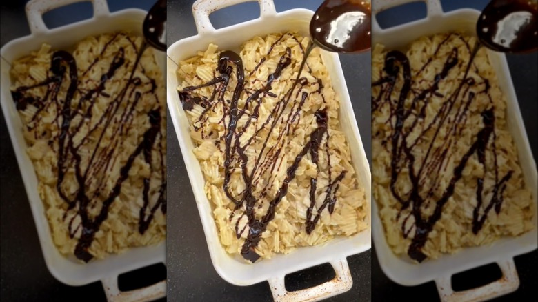Potato chip rice krispie with melted chocolate drizzle in baking dish