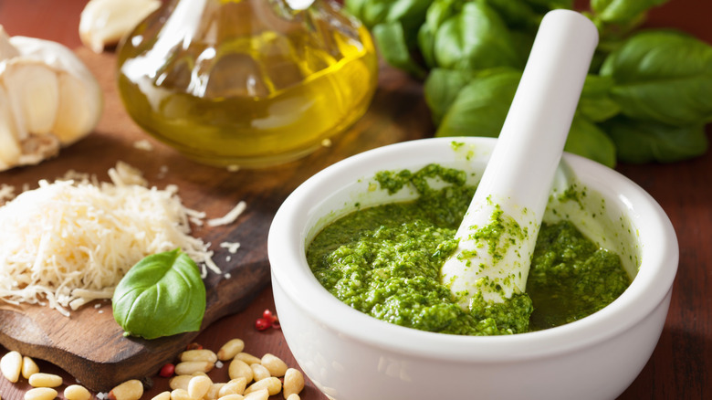 Making pesto with a mortar and pestle