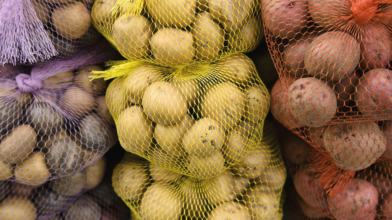 Mesh bags filled with potatoes