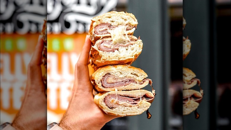 Person holding two Potbelly sandwiches