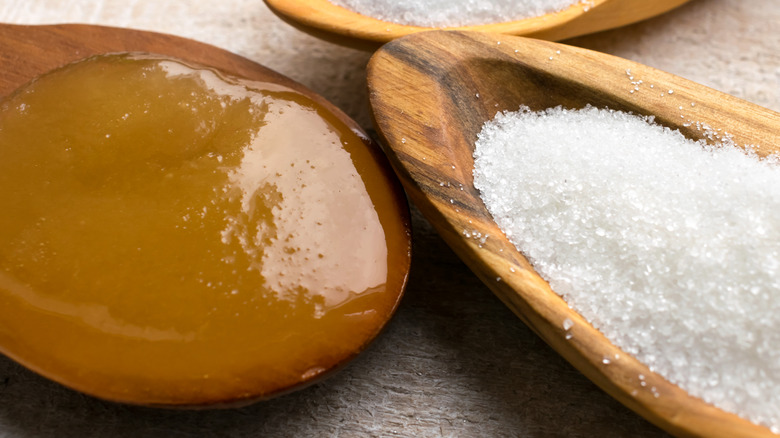 Honey and sugar on spoons