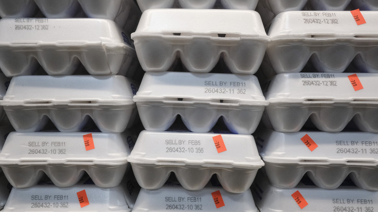 Stacks of egg cartons for sale with price tags marked "7.99"