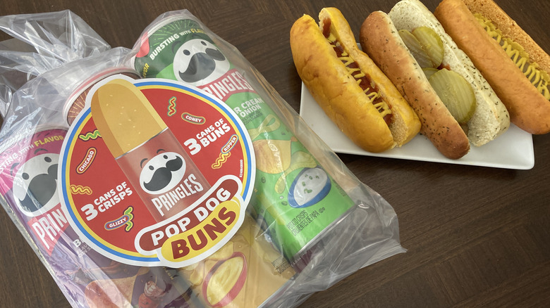 Pringles bun package and three prepared hot dogs