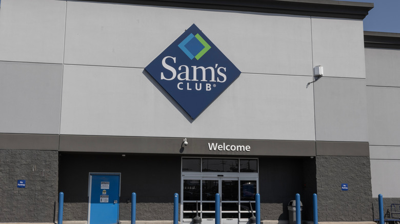 The outside of a Sam's Club warehouse, focusing on the Sam's Club sign.