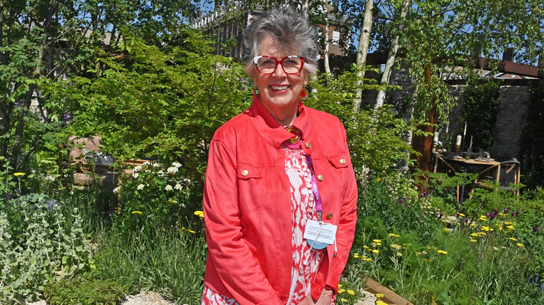Prue Leith smiling in a garden