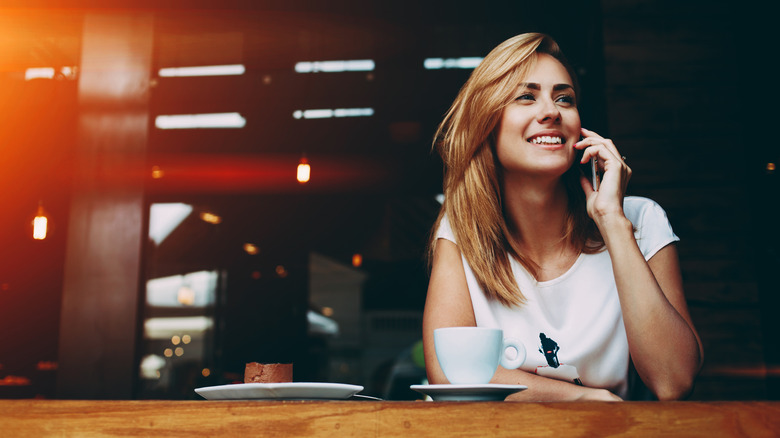 Woman on phone in coffee shop