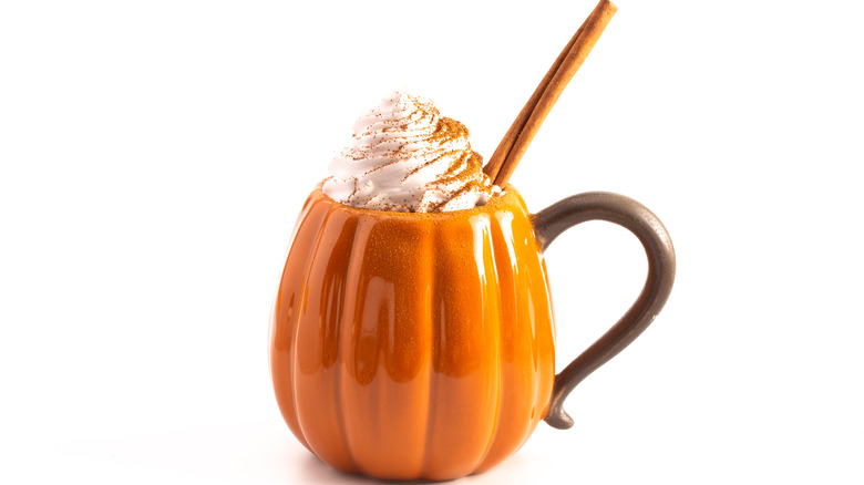 Pumpkin spice latte in pumpkin shaped mug