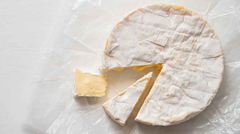 Cheese wheel on cheese paper