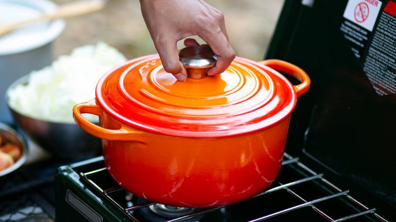 Red Dutch oven on a stove