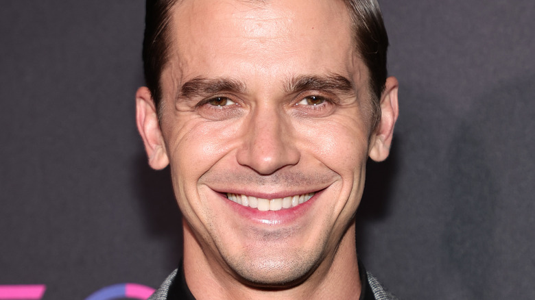 Antoni Porowski smiling at event