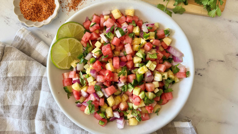 Watermelon salsa with cilantro and lime slices