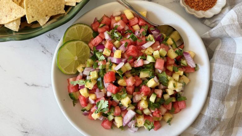 Watermelon salsa with cilantro and lime wheels