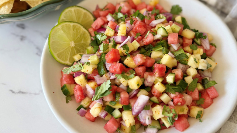 Watermelon salsa with cilantro and lime slices