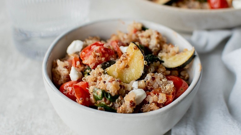 a bowl of quinoa zucchini salad