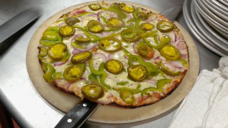 Rachael Ray pizza on board in kitchen