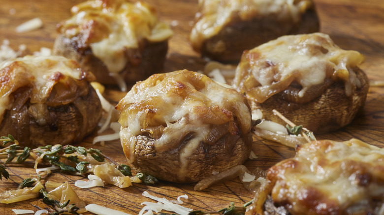 stuffed mushrooms on cutting board