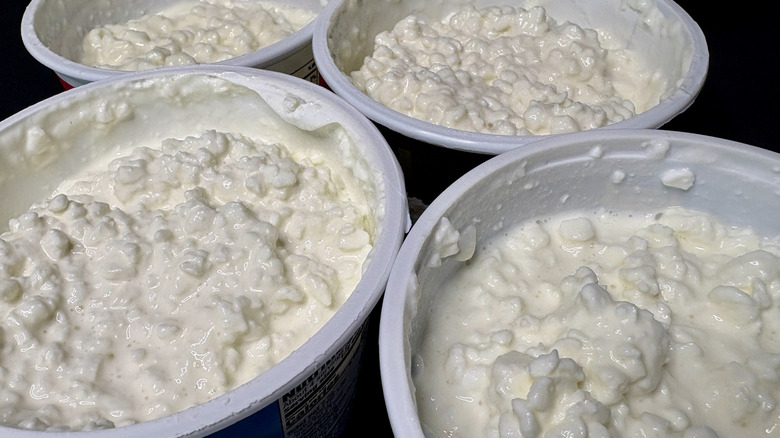 close up of cottage cheese in tubs