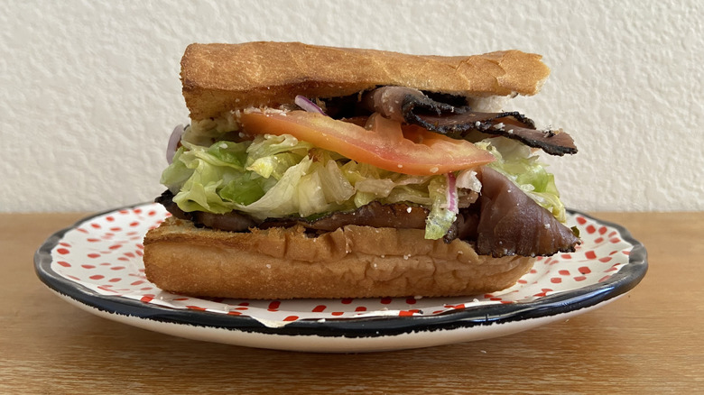 Cheba Hut sandwich half on a small plate