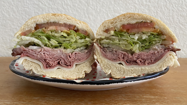 Jersey Mike's sandwich halved, facing camera, on small plate
