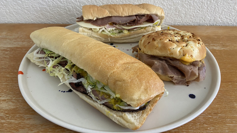 three sandwiches on a large plate