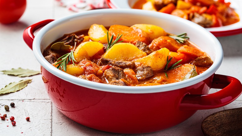 Beef stew in a red pot