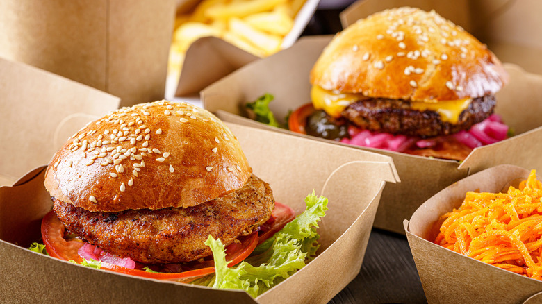 Food delivery of burger and chicken sandwich in boxes