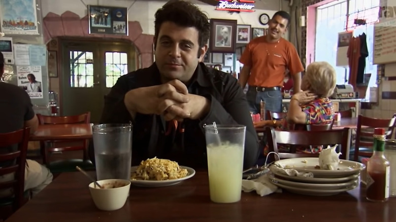 Adam Richman getting defeated by the El Taco Grande Challenge
