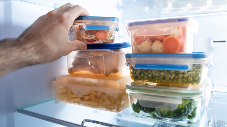 Containers of food in refrigerator 