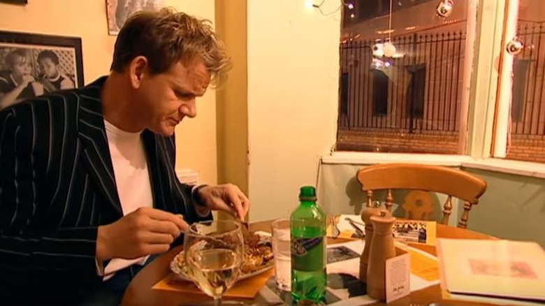 Gordon Ramsay eating at table