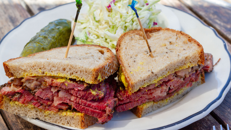 Pastrami sandwich held together with toothpicks