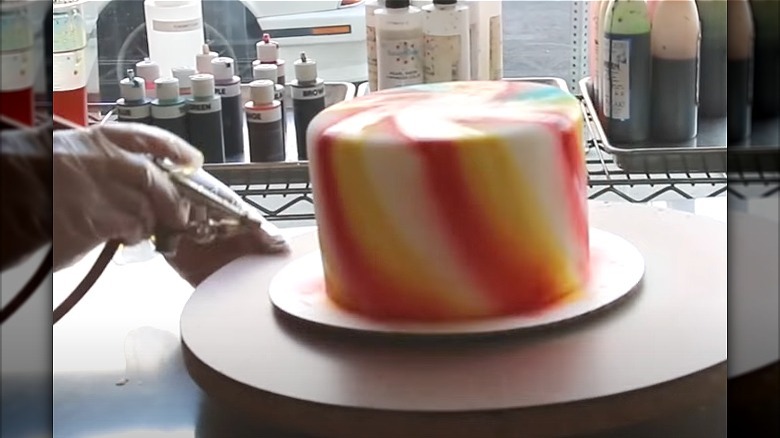 Airbrushing cake at studio