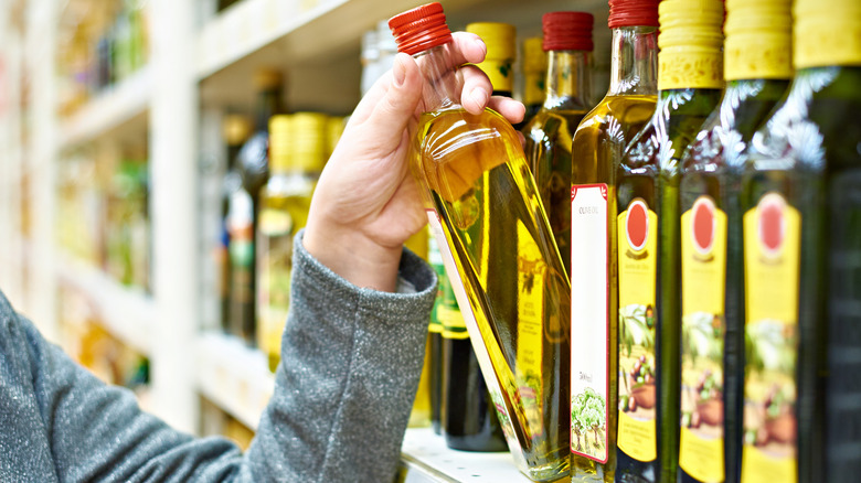 Person buying olive oil