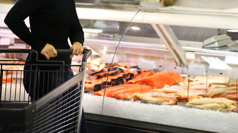 woman buying seafood