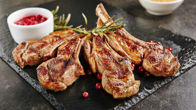 Grilled lamb chops on a black dish