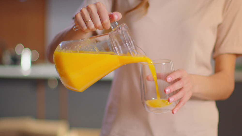 Pouring orange juice