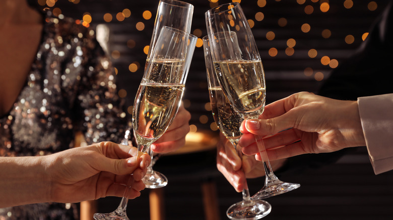 couple with sabered champagne bottle