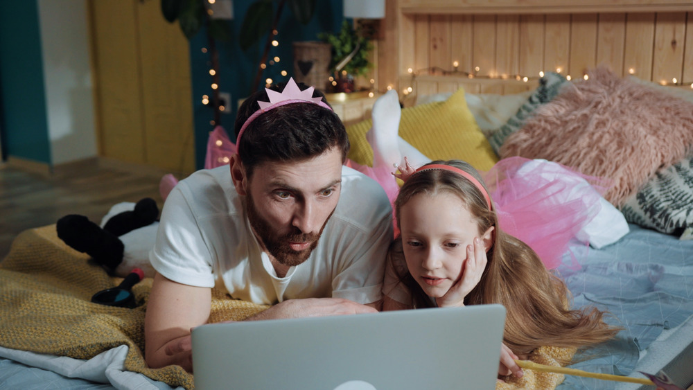 Dad and daughter playing dress-up