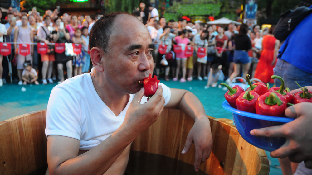 Man participating in a hot pepper competition