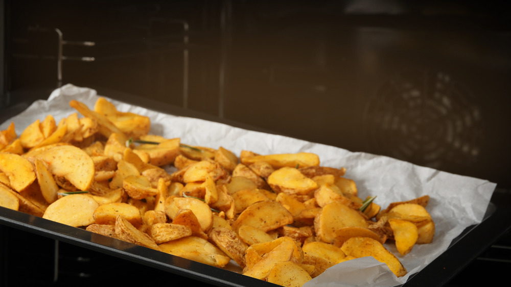 potato wedges on parchment paper