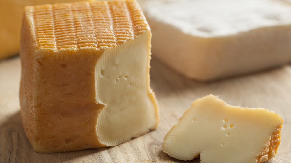 Chunk of limburger cheese with piece cut out